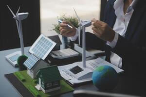 Carbon offset price report CO2 emission. Future growth Net zero waste in ESG ethical SME office protect climate change global warming social issues project. Group of asia people Eco friendly SDGs plan photo