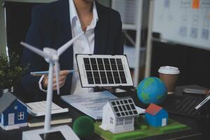 Carbon offset price report CO2 emission. Future growth Net zero waste in ESG ethical SME office protect climate change global warming social issues project. Group of asia people Eco friendly SDGs plan photo