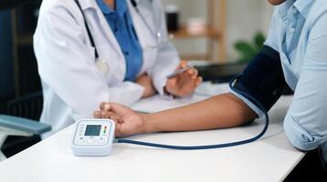 The doctor woman hand use the pulse meter to measure the pressure of the patient, medical checkup concept. photo