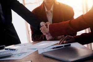 Close up of a team of business people having a meeting to analyze data for a marketing plan. photo