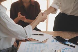 Leaders of business organizations join hands after the meeting is complete. Business partner meeting ideas. photo