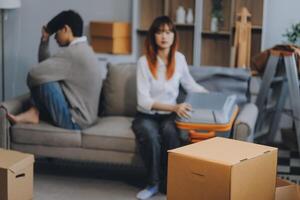 Offended couple ignoring each other after quarrel indoors, selective focus. Relationship problems photo