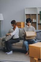 Offended couple ignoring each other after quarrel indoors, selective focus. Relationship problems photo