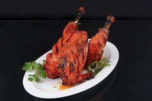 Grilled chicken on plate photo