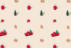 Trendy Christmas pattern made with various winter and New Year objects on pastel cream background. Minimal Christmas concept. Festive holiday pattern backdrop. Xmas aesthetic. photo