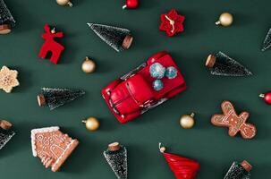 Trendy Christmas pattern made of various winter and Xmas objects on green background. Minimal creative Christmas and New Year concept. Festive holiday pattern backdrop. Christmas aesthetic. Flat lay. photo