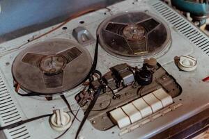 Old tape recorder playing music in a cozy, ambient setting photo