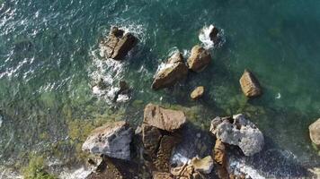 footage of the coast from a height, high view angle footage, drone footage in a beach, high view angle a sea, 4K , 60 fps video
