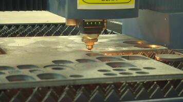 Demonstration of automated Laser CNC cut of metal with light beams technology modern industrial. High precision CNC Laser beam engraving cutting of heavy metal sheet with spark. Metal working plant. video