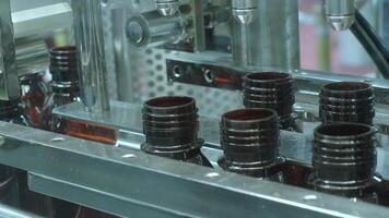 Bottles filling automation machine in modern factory. Technology demonstration of filling and capping bottles in the industry. Inspection of Vials For Defects. Pharmaceutical and drink Manufacturing. video