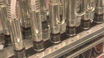 Bottles filling automation machine in modern factory. Technology demonstration of filling and capping bottles in the industry. Inspection of Vials For Defects. Pharmaceutical and drink Manufacturing. video