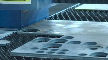 Demonstration of automated Laser CNC cut of metal with light beams technology modern industrial. High precision CNC Laser beam engraving cutting of heavy metal sheet with spark. Metal working plant. video
