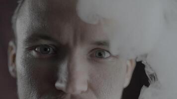 Man in Deep Contemplation Surrounded by Smoke in Close-up View video