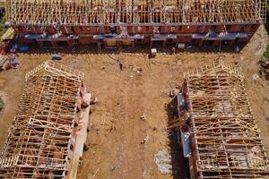 New house under construction, wooden truss system forming roof. Process of building project. photo