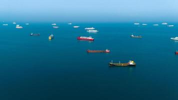 Serene seascape with a fleet of cargo ships dotting the tranquil blue ocean, capturing the essence of maritime logistics and global trade photo