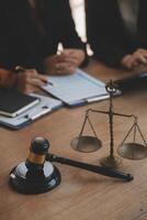 Lawyer, legal advisor, businessman brainstorming information on agreement details Business contracts in legal processing books for accuracy in contract documents. joint financial investment. photo