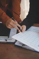 Lawyer, legal advisor, businessman brainstorming information on agreement details Business contracts in legal processing books for accuracy in contract documents. joint financial investment. photo