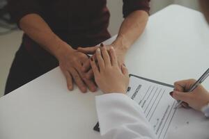 Female doctors shake hands with patients encouraging each other To offer love, concern, and encouragement while checking the patient's health. Concept Health care and Social Security photo