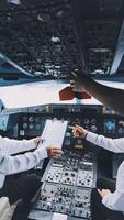 Professional pilot woman in uniform has teamwork meeting for success flight in aviation business. Young female captain instructor sitting in office and working or training commercial airline crew. photo