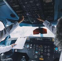Professional pilot woman in uniform has teamwork meeting for success flight in aviation business. Young female captain instructor sitting in office and working or training commercial airline crew. photo