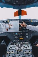 Professional pilot woman in uniform has teamwork meeting for success flight in aviation business. Young female captain instructor sitting in office and working or training commercial airline crew. photo