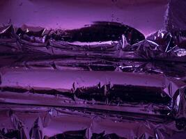 Plastic texture in dark purple light at night for abstract background photo