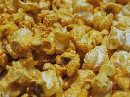 Delicious sweet popcorn, close-up shot for dessert food background. photo