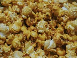 Delicious sweet popcorn, close-up shot for dessert food background. photo