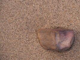 Brown rocks on sand for product display or background ,copy space photo