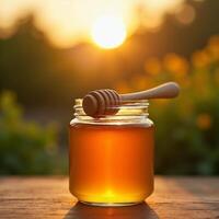Honey in jar with sunrise background photo