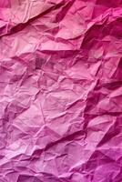 Crumpled pink paper texture with varying shades and deep folds. Abstract background. photo