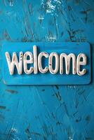 Welcome sign on a blue textured background in a cozy space photo