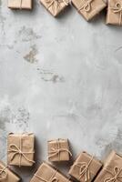 Wrapped parcels arranged on a smooth gray surface for a festive occasion, copy space. photo