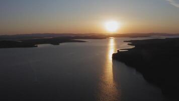 Sunrise over the horizont. Calm sea in calm, shining reflections video