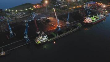 Bird's eye view of port crane and coal handling operations video