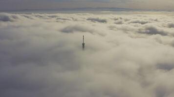 Aerial view of the upper part of the broadcasting tower in the fog video