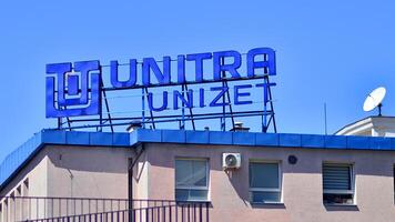 Warsaw, Poland. 31 July 2024. Wola business district in the city center with office centers and modern buildings. Urban landscape. Company signboard Unitra Unizet. photo