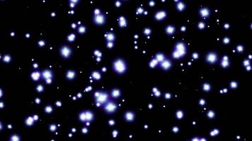 Abstract magical flashes of light. Bright glitter particles and stars twinkle and glow on a dark background. seamless loop video