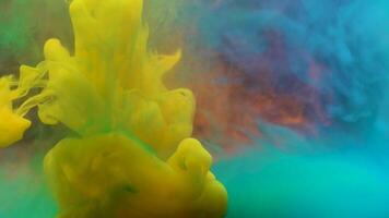 Color paint drops in water, abstract color mix , drop of Ink color mix paint falling background video
