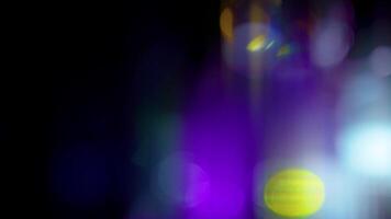Lens flare on dark background. Real fancy optical light leaks visual effect. video