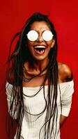 Joyful Young Woman with Vibrant Dreadlocks Laughing in Studio Setting photo