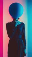 Mysterious Hooded Silhouette in Abstract Blue and Pink Lighting photo