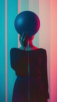 Surreal Floating Sphere Silhouette in Moody Neon Lighting photo