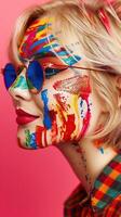 Captivating Portrait of Fair Skinned Woman Expressing Vibrant Emotions through Colorful Paint photo