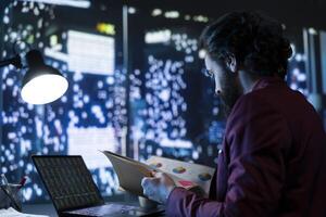 Rich hedge fund manager looking at international stock market, examining financial operations and selling business shares. Influential trader obtaining necessary liquidity for branch expansion. photo