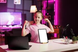 Gen Z media star filming about best mockup tablet launched this year. Kid tech content creator recording isolated screen device review, assessing build quality and performance photo