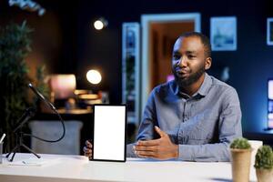 Tech guru excited to review newly released mockup tablet, comparing features with older models. Influencer filming for social media, analyzing latest generation of isolated screen digital device photo