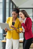 Excited business colleagues discussing over a digital tablet, sharing ideas in a dynamic office setting. photo