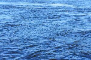 The texture of ripples on the water. Natural background. photo