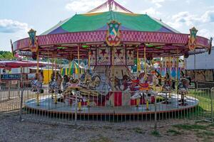 Vintage Merry go around carnival ride at the fair photo